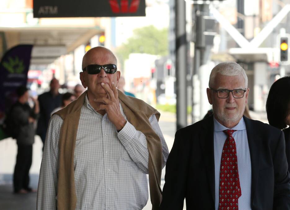 Final taste of freedom: Graeme Lawrence walks to court on Wednesday with solicitor John Anthony. Picture: Simone De Peak