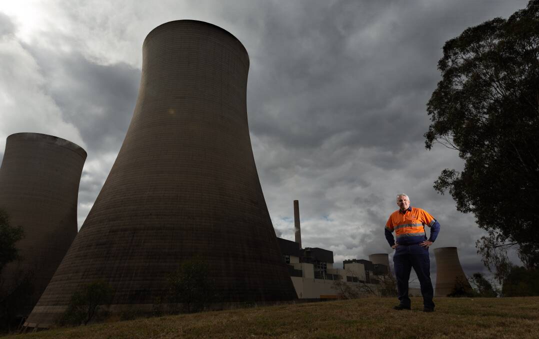 Bayswater general manager Len McLachlan standing next to one of the plant's cooling towers. Picture by Jonathan Carroll. 