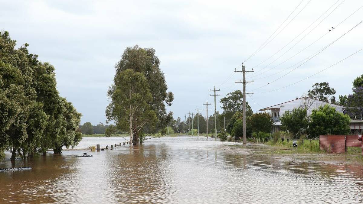 Flooding at Hinton on the Paterson River following the recent deluge keep SES volunteers busy with calls for assistance. Pictures Peter Lorimer.