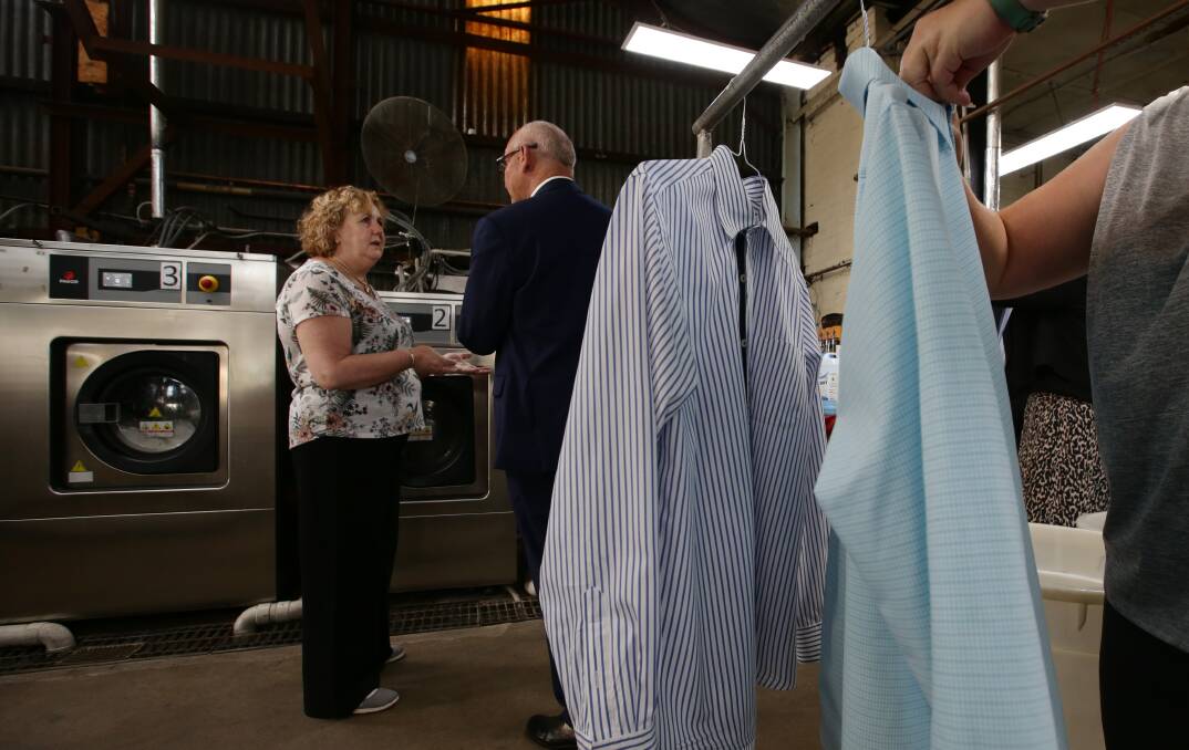 Sustainable: Pride Dry Cleaning and Laundry owner Jennie Lyons speaks with Small Business Minister Damien Tudehope about the business's water efficiency measures. Picture: Simone DePeak