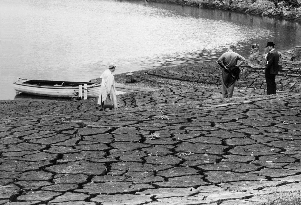 Searching for answers: Visitors disembark from a boat at Chichester Dam during the 1960s drought. The dam is presently 59.9 per cent full, while overall storages are at 63.8 per cent.