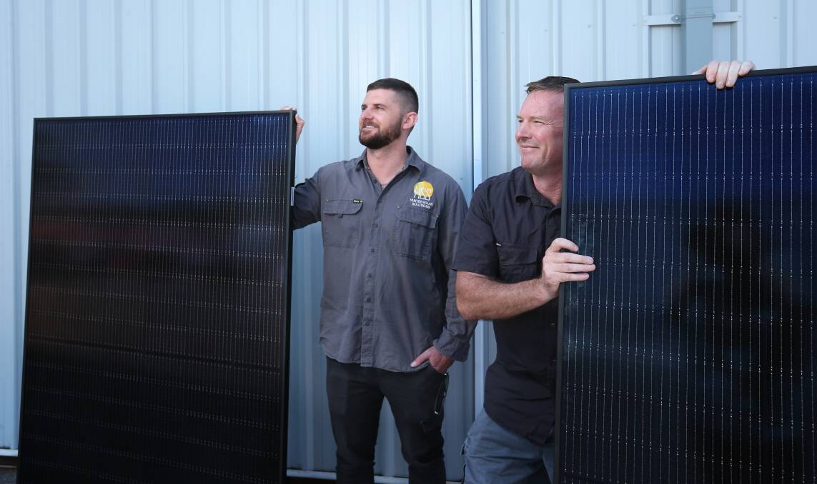 Hunter Solar Solutions owners Luke Williams and Mick Geraeds. Picture by Simone DePeak