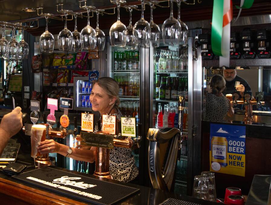 Closing time: Northern Star licensee Michelle Ramplin serves a beer shortly before it closed at midday. Picture: Marina Neil