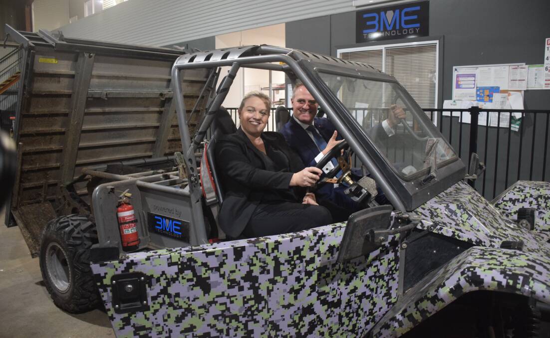 Ready to drive: Liberal Shortland candidate Nell McGill and Assistant Minister Tim Wilson with the LEV1 on Thursday.