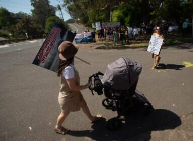 A Port Stephens resident protesting last year. Picture by Jonathan Carroll