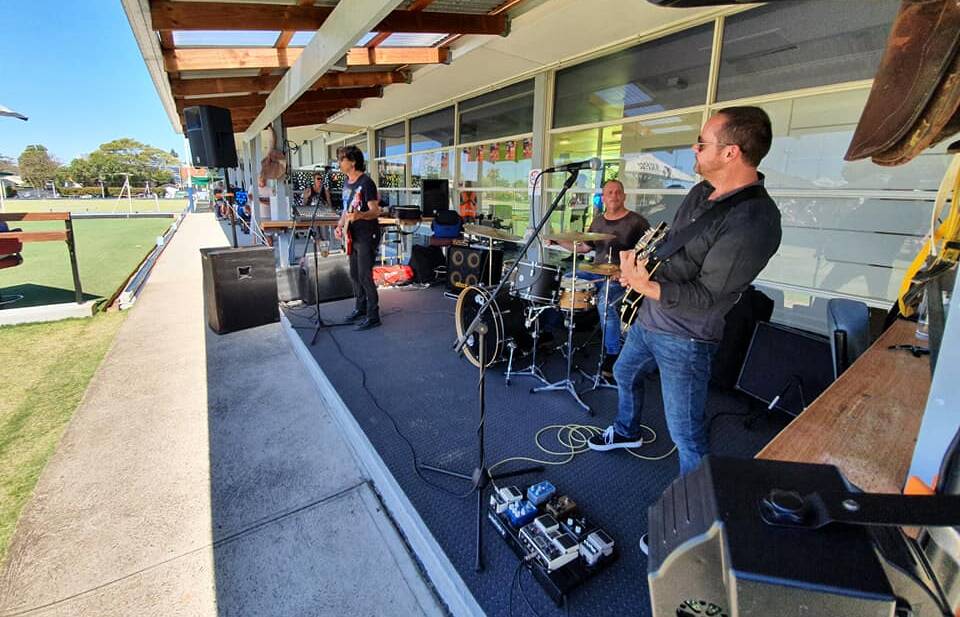 Newcastle band Hornet perform outdoors at Adamstown Bowling Club.