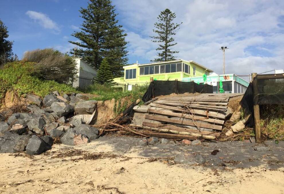 Disaster: A section of the boardwalk connecting the beach to the cafe that was lost to severe erosion. Picture: Marina Neil