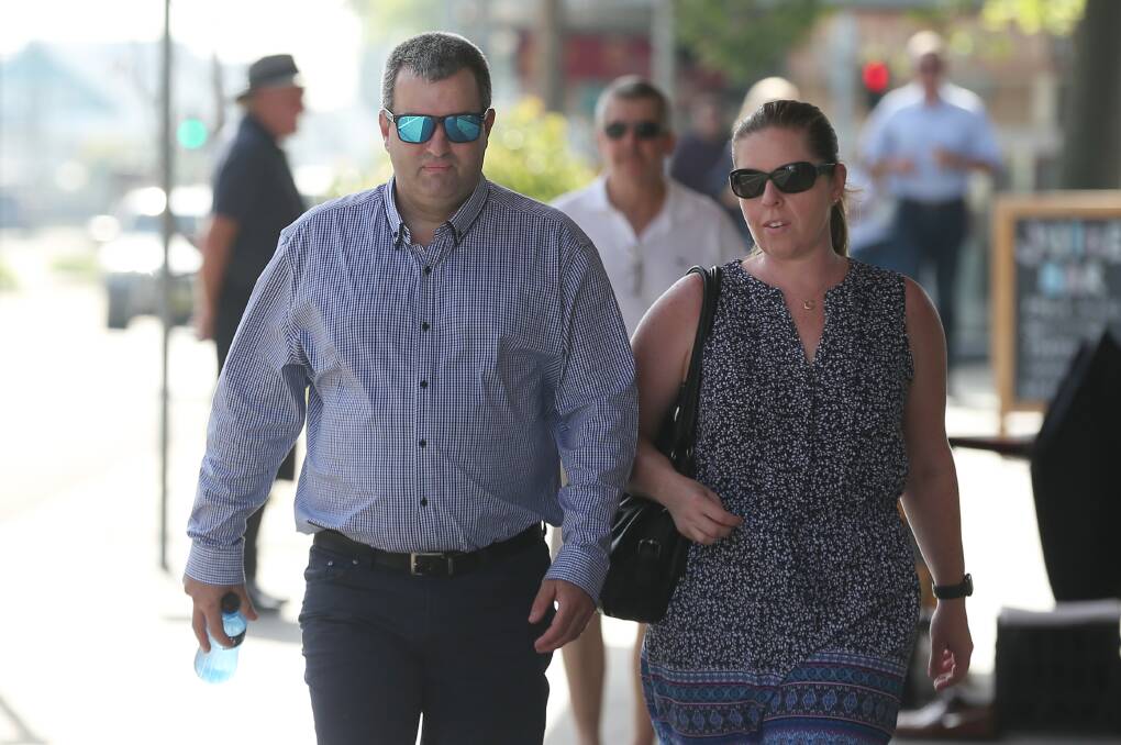 Standing tall: Ben Giggins and his wife Jane arrive at Newcastle Court on Thursday for the sentencing of Graeme Lawrence. Picture: Simone De Peak