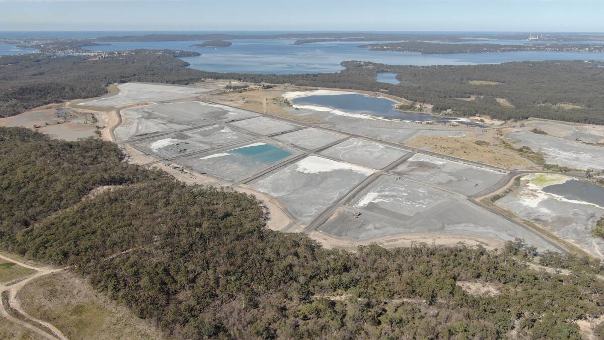 Wasteland: The Eraring Power station ash dump on the shores of Lake Macquarie. Origin Energy has built a haul road which is 92 per cent coal ash. 