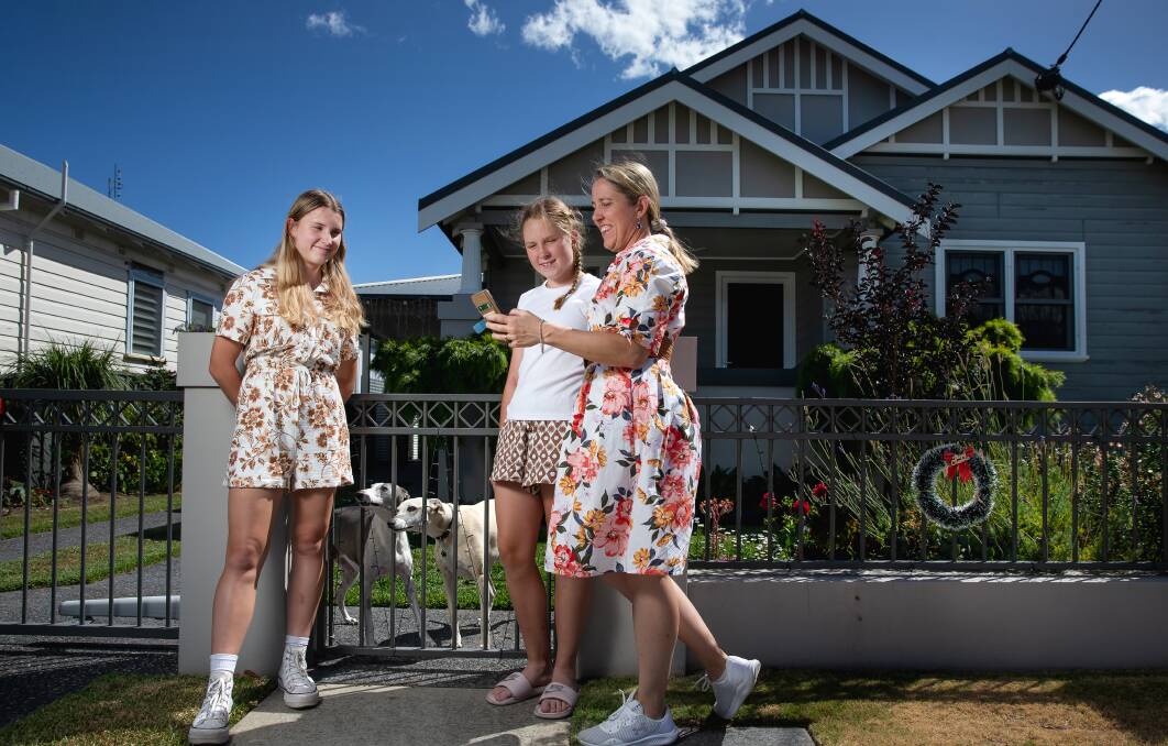 Katherine McIlwain with daughters Sarah and Lilly outside their Hamilton South home. Picture by Marina Neil 