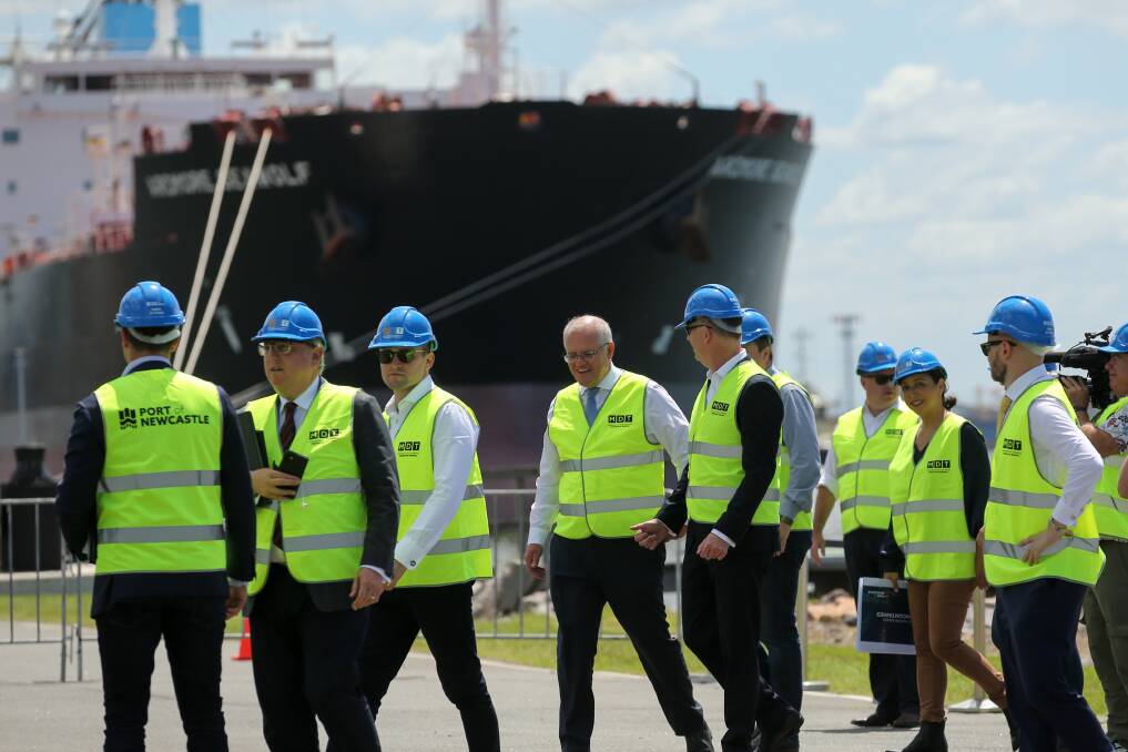 Hat's off: Prime Minister Scott Morrison meeting with Port of Newcastle representatives on Thursday. Picture: Max Mason Hubers. 