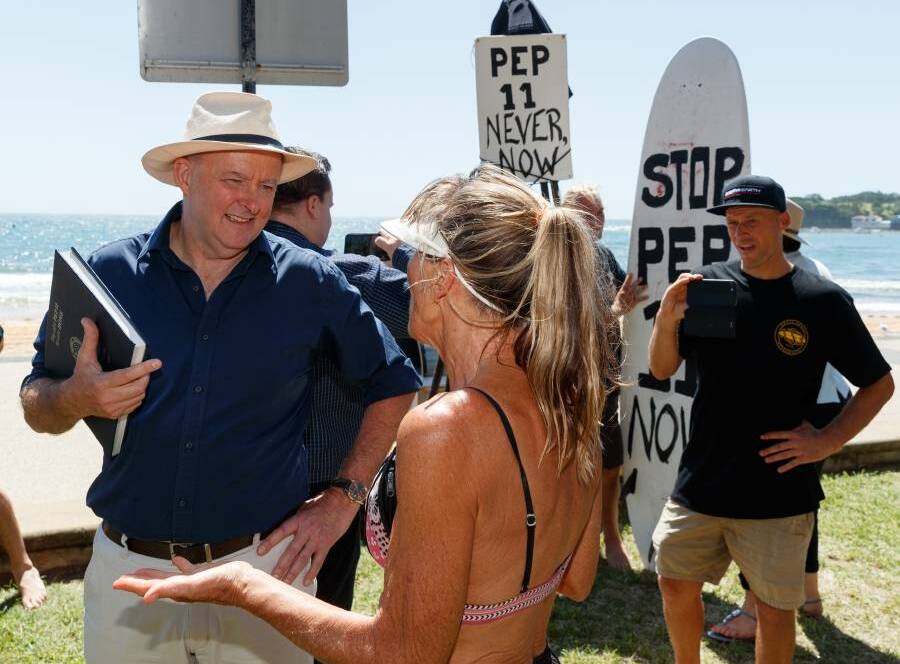 Then Opposition Leader Anthony Albanese discusses his concerns about PEP-11 with a local at Terrigal in February 2021. Picture: Max Mason Hubers.