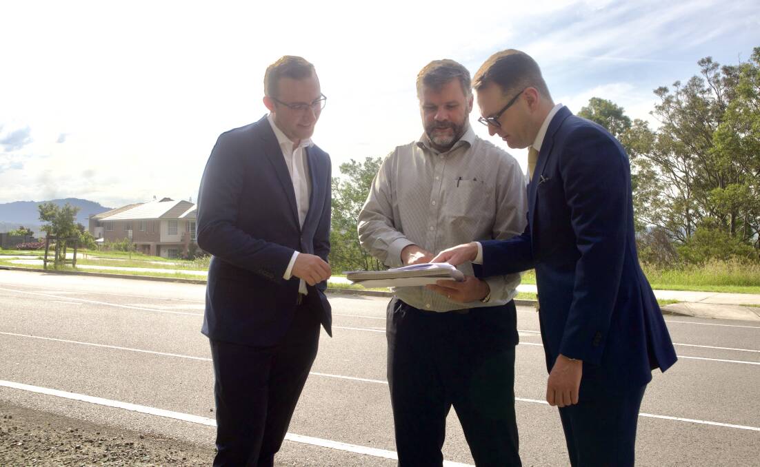 Cr Callum Pull, planning consultant Stephen Barr and Senator Andrew Bragg inspect plans for the site on Monday. 