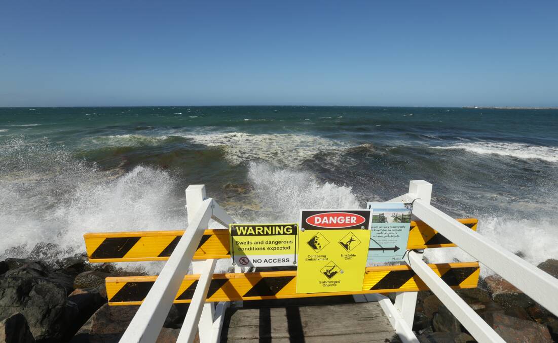 Hazard warning: A former beach staircase that was washed away in heavy seas last September. 