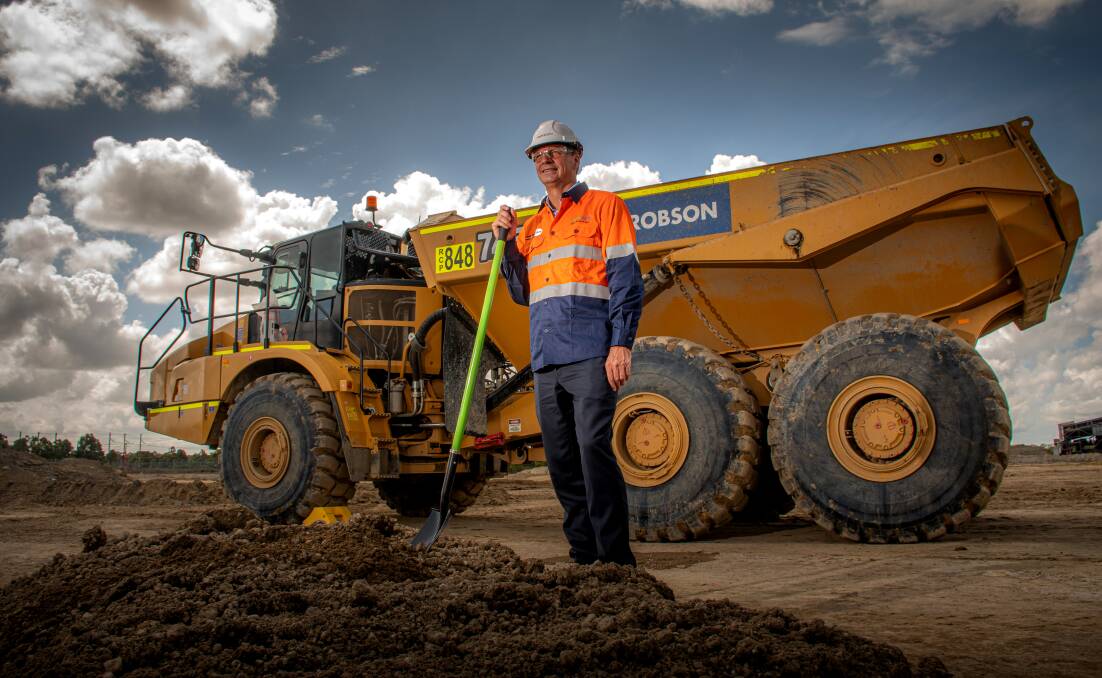 Digging in: Energy Minister Angus Taylor turns the first sod at the Hunter Power Project on Wednesday. Picture: Simon McCarthy. 