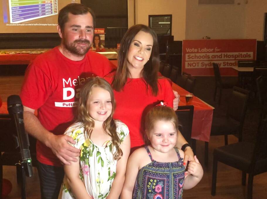Strong campaign: Labor's Melanie Dagg with husband Josh and daughters Amelia and Eliza at Club Singleton on Saturday night. 