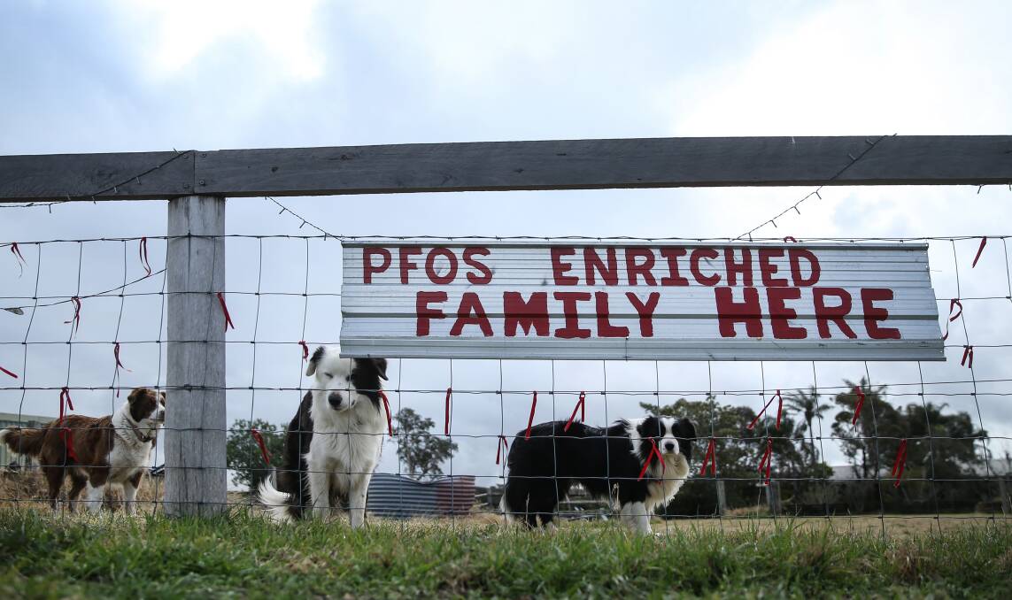 Not impressed : A sign attached to a property in Williamtown. Residents are seeking compensation for damage PFAS contamination has caused to their land value. Picture: Marina Neil