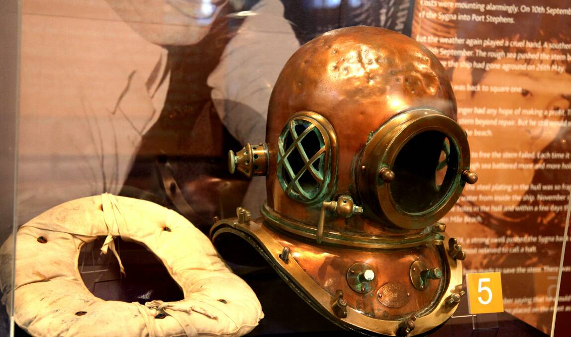Relic: The diving suit helmet used by Kintoku Yamada, who led the salvage operation of the Sygna on Stockton Beach in 1974, on display at the maritime museum.