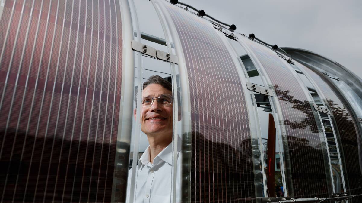 RAY OF LIGHT: Professor Paul Dastoor, of the University of Newcastle, with his printed solar cell technology. Picture: Max Mason-Hubers