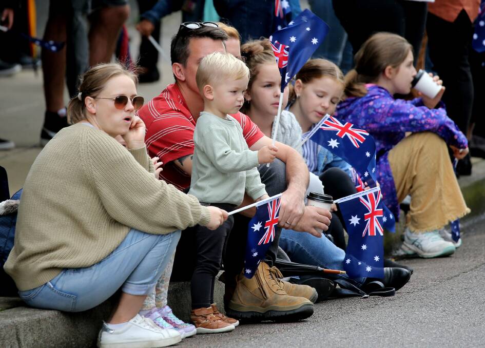 The Jones family watch the Anzac Parade. Picture: Peter Lorimer.