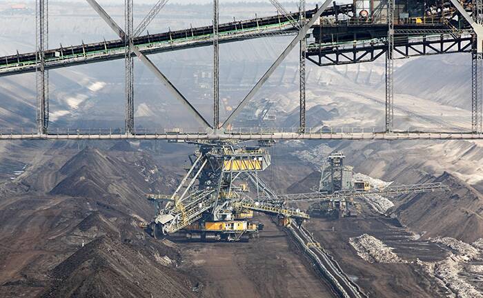Earthmovers work in an open-cast brown coal mine in Jnschwalde, Germany.