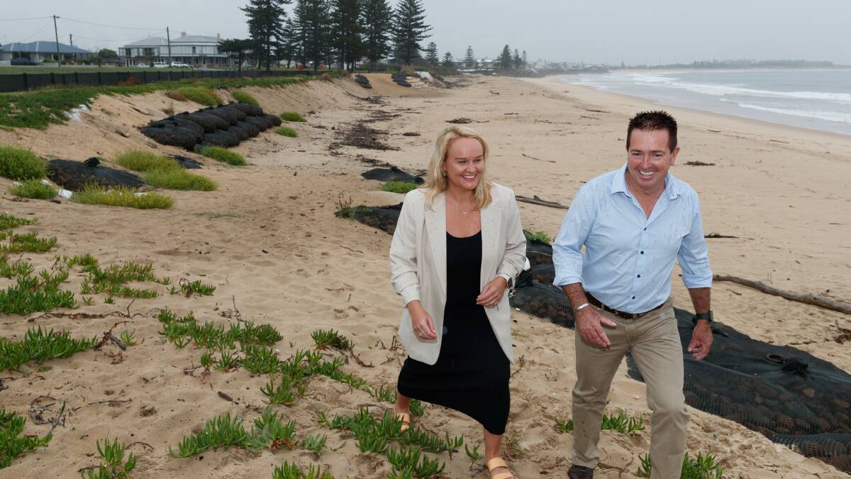 Deputy Premier Paul Tool and Newcastle Lord Mayor survey Stockton Beach on Monday. Picture by Max Mason-Hubers