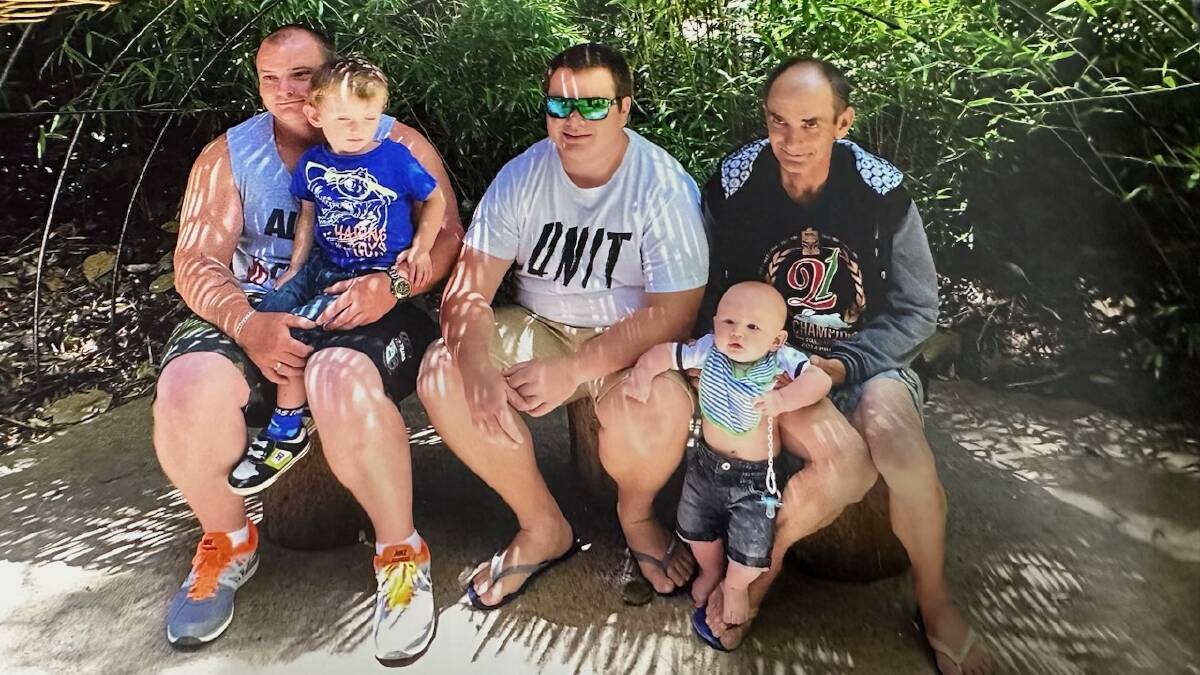 Steve Klus (right) holding grandson Tyler with his sons Matthew (right) and Chris. Matthew is holding grandson Kye. 