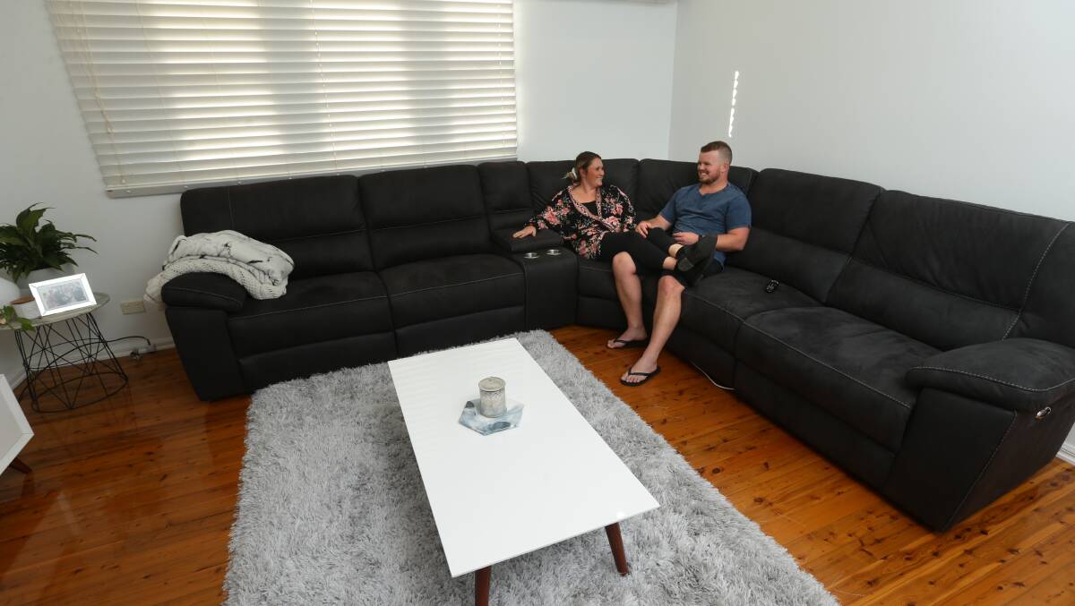 Home sweet home: First home buyers Hollie and Dylan Streeter bought their three bedroom house in Cardiff South in February after saving for a deposit for two years. Mr Streeter said surrounding infrastructure affected their decision to live in the suburb. Picture: Jonathan Carroll