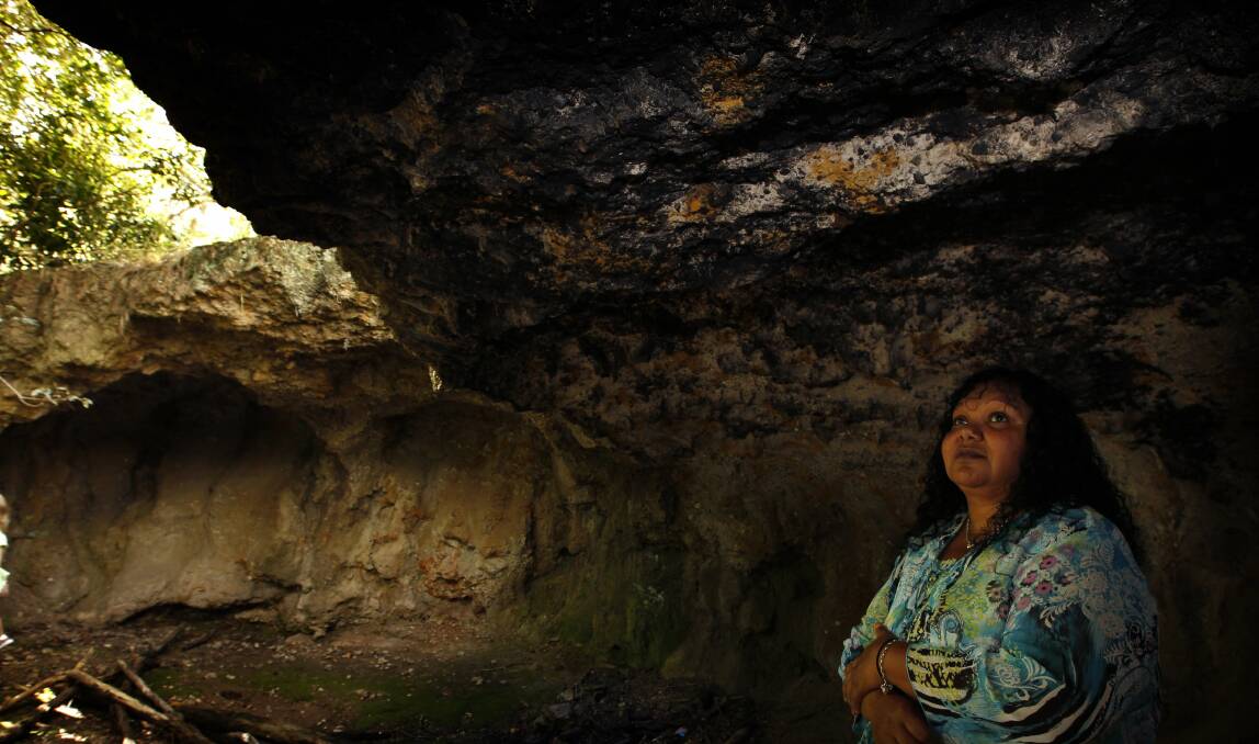 Sacred: Melinda Brownmin from the Sugarloaf Action Group at the Butterfly Cave in 2012. Picture: Peter Stoop