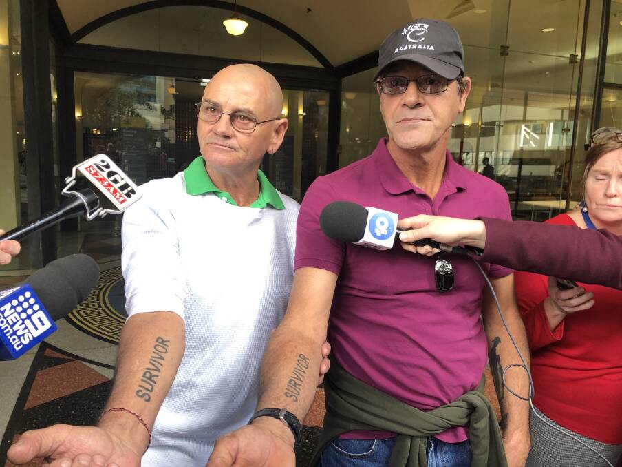 Survivors: Gerard McDonald and Scott Hallett who were abused by Vince Ryan at The Junction in the 1970s, show their Survivor tattoos. Picture: Matthew Kelly