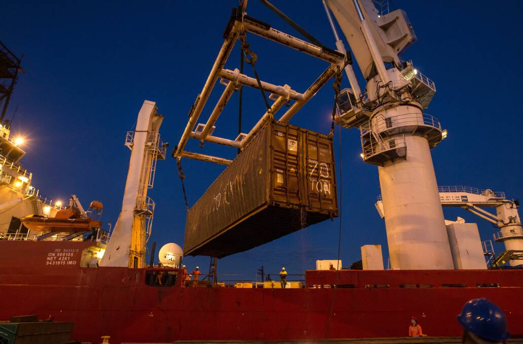A 12-metre, 70 container full of IKEA furniture is unloaded in Newcastle on Friday night. Picture: Marina Neil.