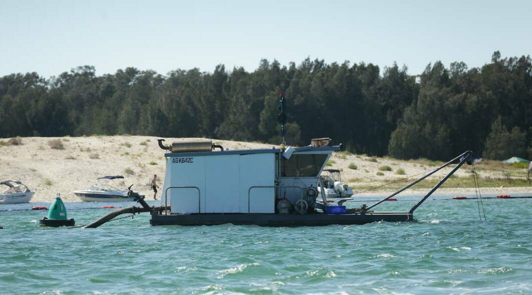 A dredge working in Swansea Channel near the southern entrance to Swan Bay.