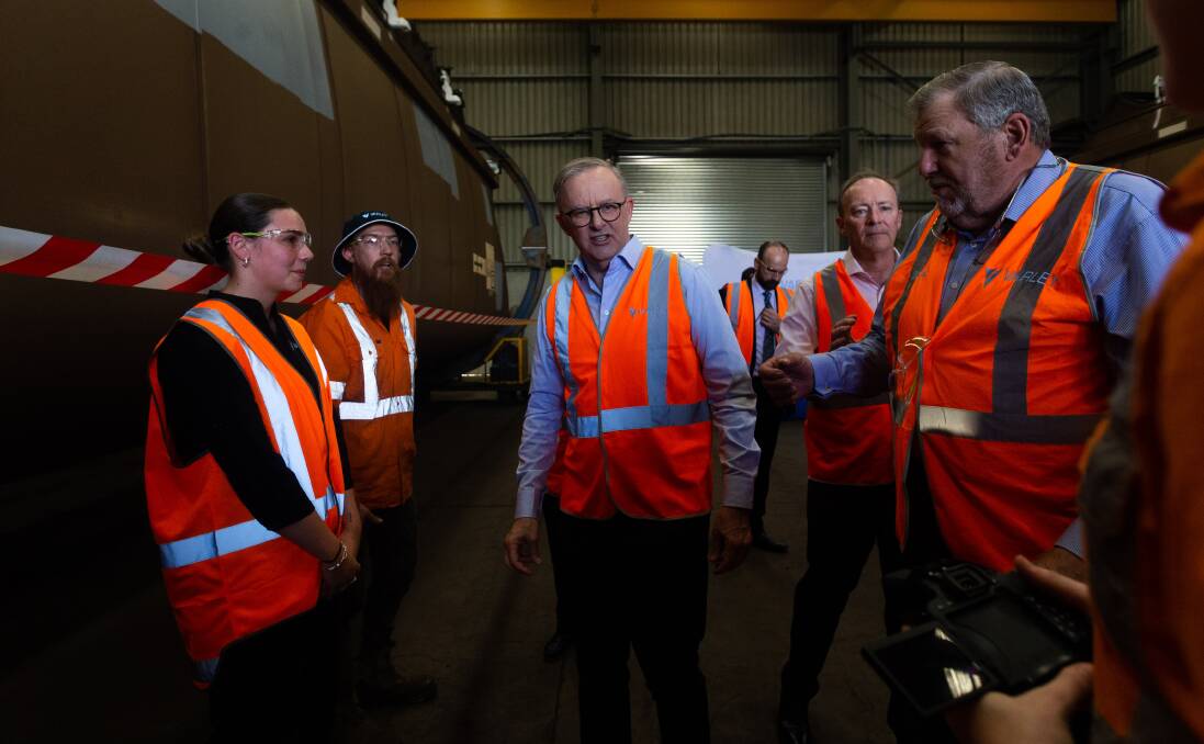 Mr Baldwin (right) escorts Prime Minister Anthony Albanese on a tour of Varley's Carrington workshop last month. Picture by Jonathan Carroll. 