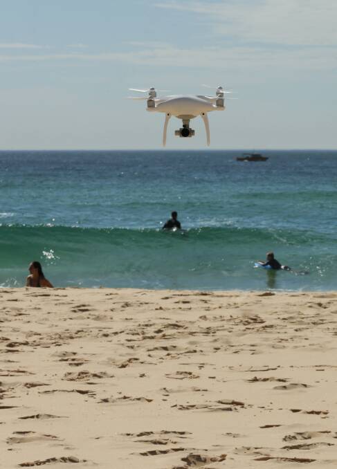 Eye in sky: A shark drone over Redhead Beach. Drones have been shown to be a more effective shark mitigation measure than netting. Picture: Simone De Peak