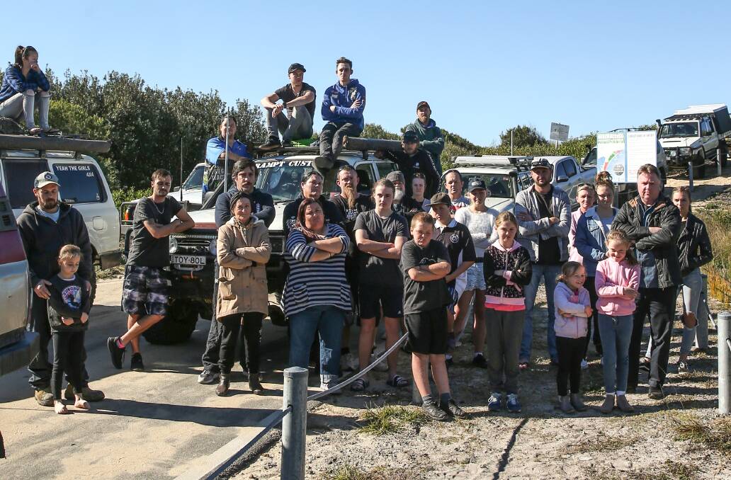 Standing firm: Lake Macquarie 4WD enthusiasts gather at the entrance to Nine Mile Beach at Blacksmiths. Councillor John Gilbert has launched a campaign to protect 4WD access rights to the beach. Picture: Marina Neil 