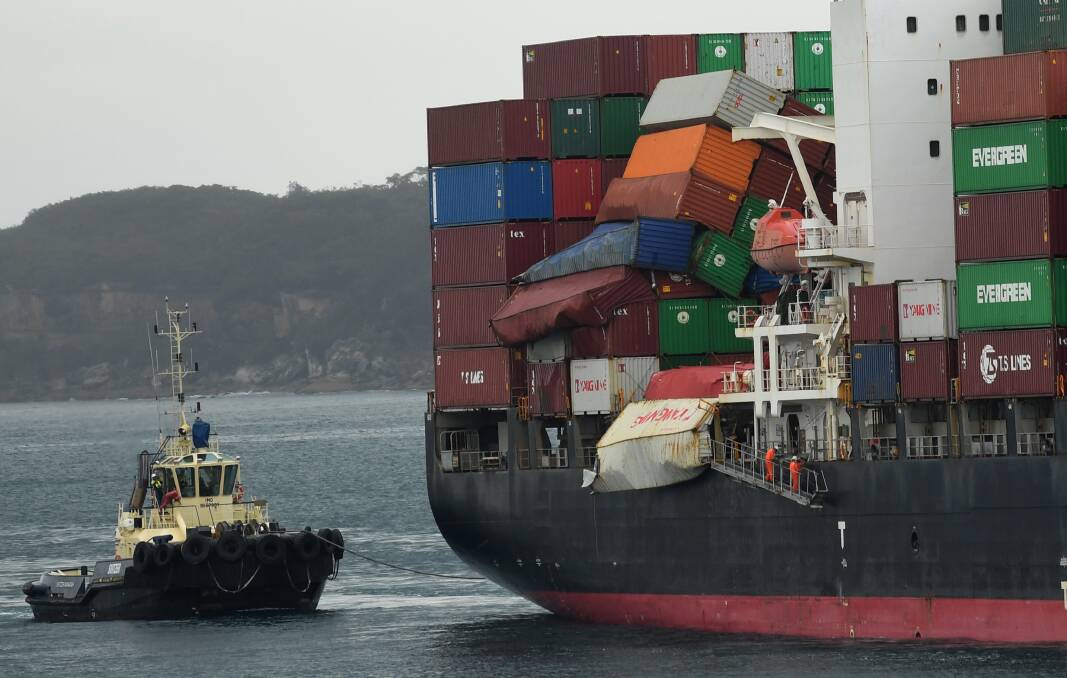 Unfolding disaster: Cargo containers falling from the YM Efficiency in June 2018. The federal government has sent the ship's owners a bill for cost of the clean-up. 
