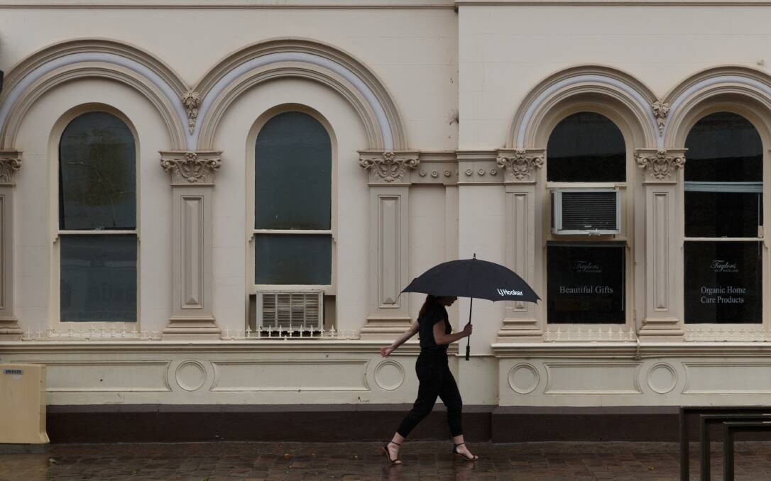 Umbrellas were a common sight in Maitland on Tuesday. Picture: Max Mason-Hubers