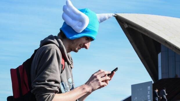 A Pokemon fan on the hunt around Sydney. Picture: Peter Rae
