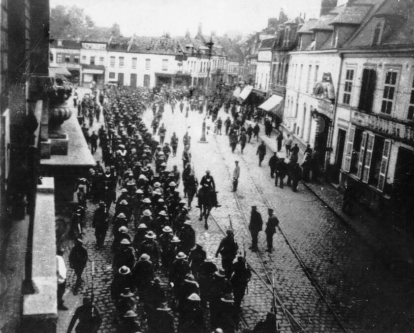 FRANCE: Western Front - Nord Region, Lille. c July 1916. Men of the 5th Australian Division, taken prisoner during the battle of Fromelles on 19 July 1916, being marched through the streets of Lille to the rear of the German lines. Picture: Australian War Memorial, C03112 