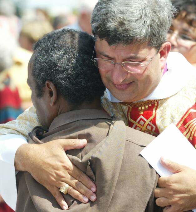 Bishop Roger Herft greets Br Samson Amoni in 2005. Picture: Brock Perks