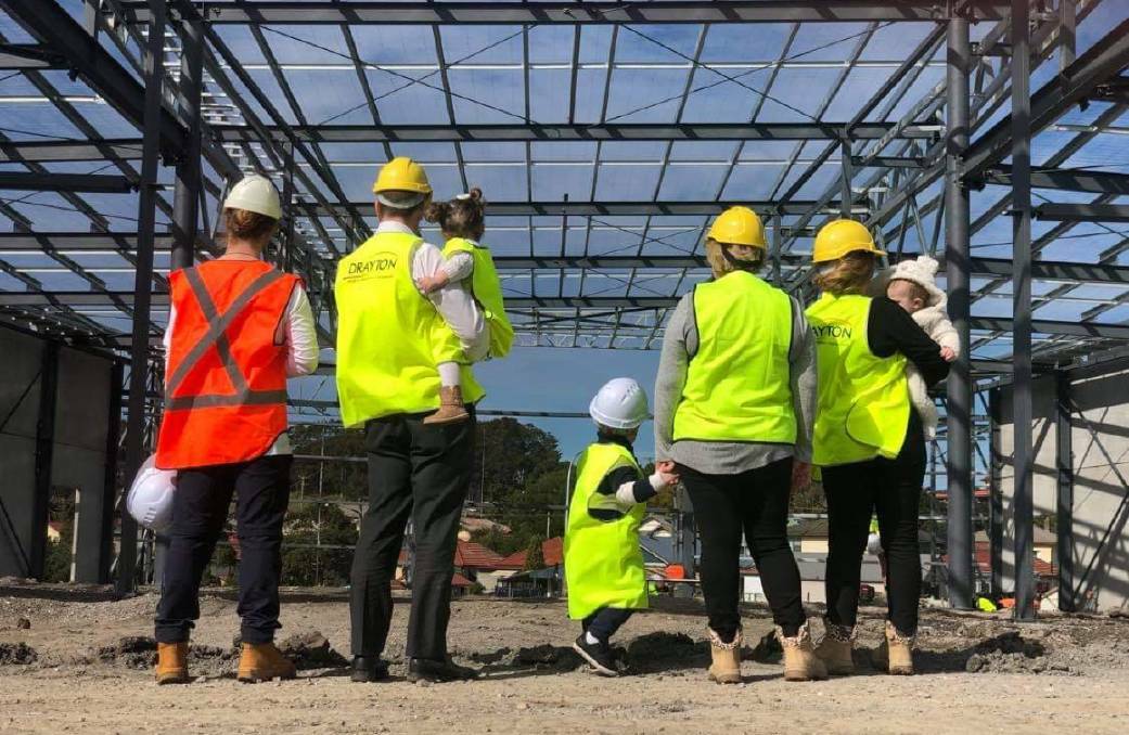 BUILDING: The Pettigrew family tours the Mayfield West site as it was under construction.