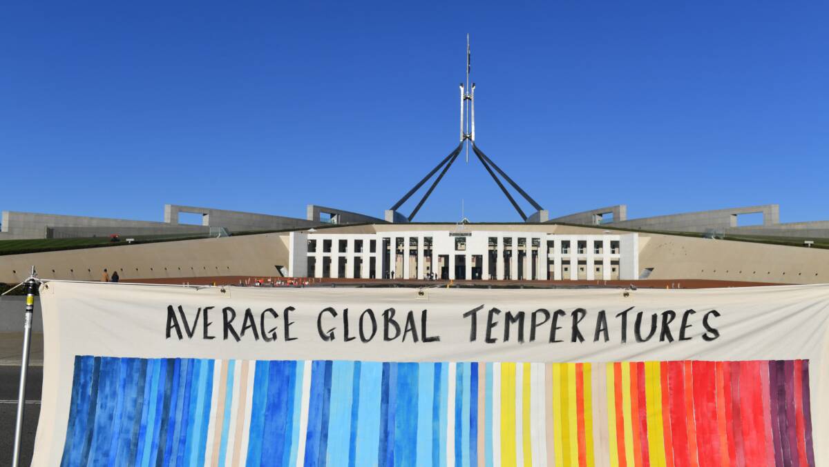 A banner depicting global temperatures by knitters from Common Grace's Knit for Climate Action initiative. Picture: AAP
