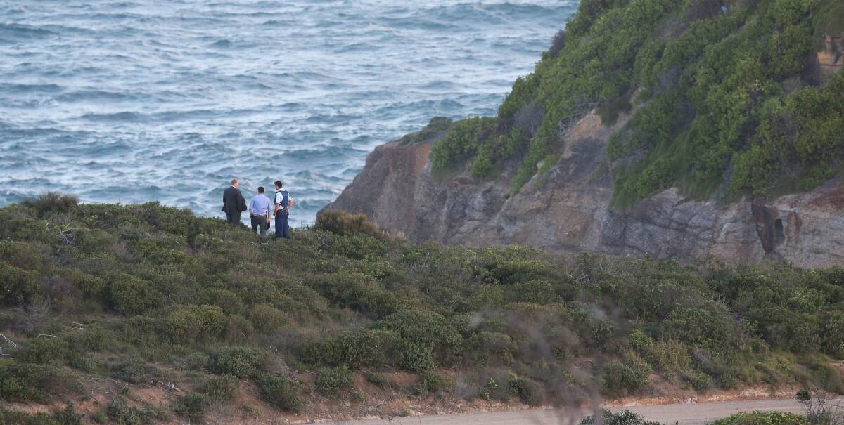 MYSTERY: Police at the blowhole next to Snapper Point. Despite a large search, detectives still do not know the identity of the murder victim discovered naked and face down on Sunday. Picture: Marina Neil.