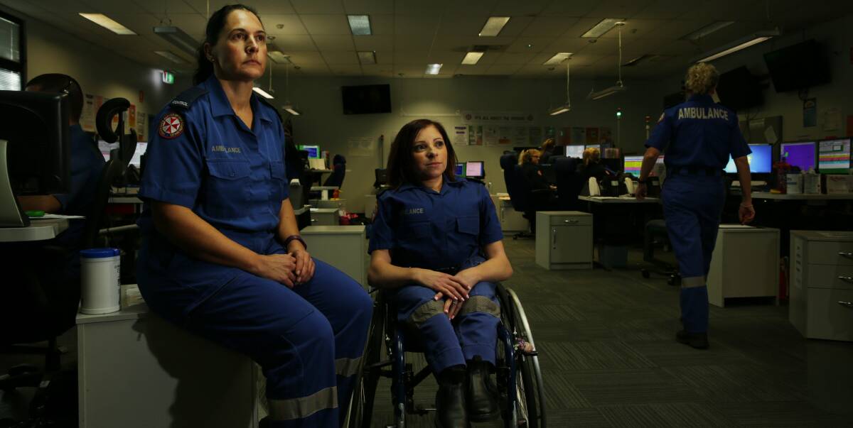 THREATENED: NSW Ambulance officers Melanie Mayer and Jodie Owen at the Charlestown call centre. They say abuse is on the increase and are part of a statewide campaign to stop it. Picture: Simone De Peak