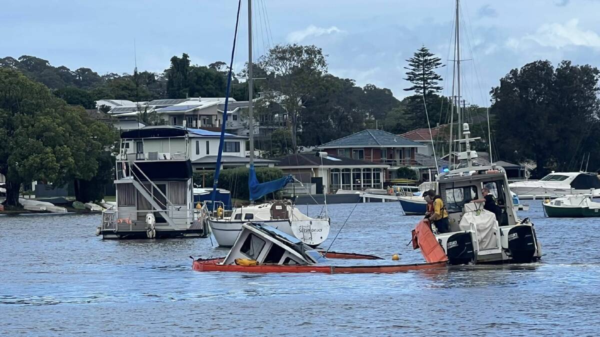 Firefighting boat assists after boat sinks at Lake Macquarie. Pictures from Facebook