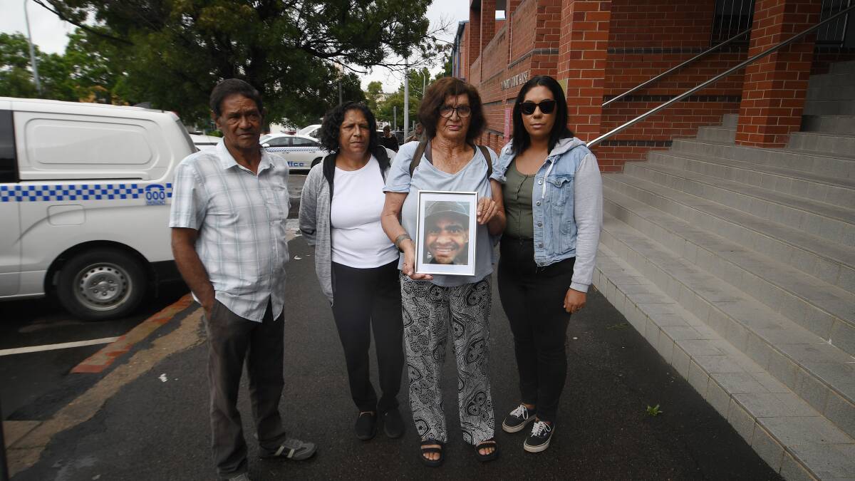 William Haines' father Roy with family members outside court on Tuesday morning before the inquest started. Picture by Gareth Gardner