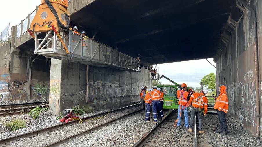 Crews working on the Tarro Rail Bridge. Picture supplied by Transport for NSW