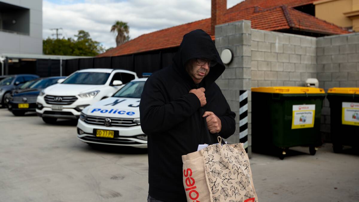 Brett Andrew Button leaves court in Cessnock after he was granted bail in the aftermath of the Greta bus crash. Picture by Jonathan Carroll
