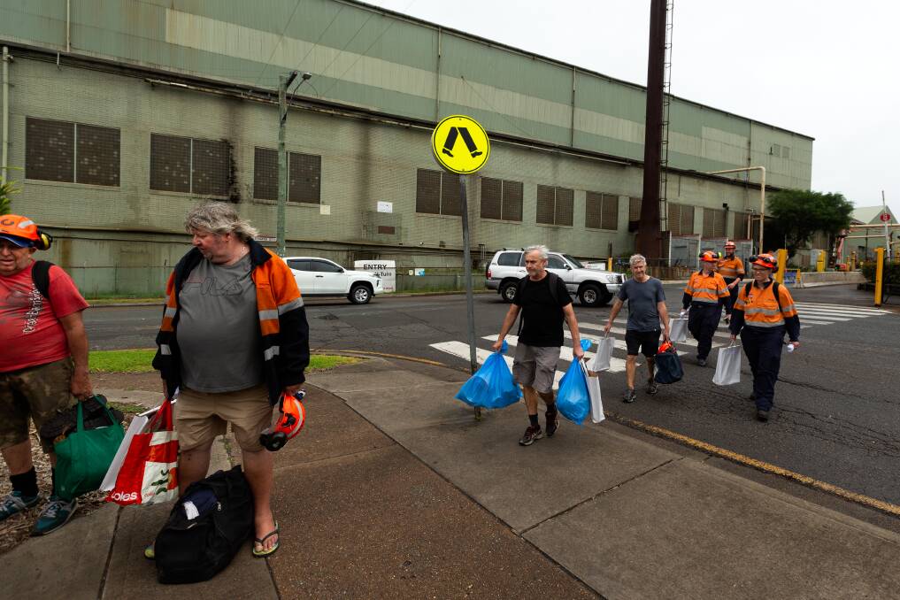 Bar mill workers walk off the job for the final time on Thursday. Picture by Jonathan Carroll