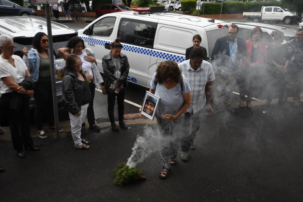 Family of Aboriginal man William Haines at the smoking ceremony outside Tamworth court on the first day of the inquest into his death in custody. Picture by Gareth Gardner